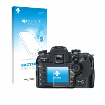 Face avant d’un emballage produit avec le logo de la marque upscreen. À côté, l’appareil Konica Minolta Dynax 7D est représent