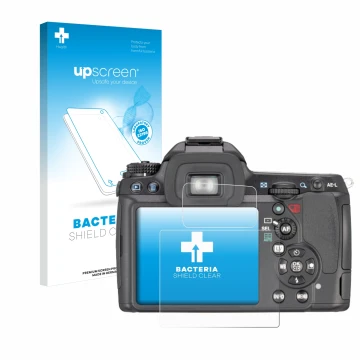 Face avant d’un emballage produit avec le logo de la marque upscreen. À côté, l’appareil Pentax K7, K-7 est représenté avec la
