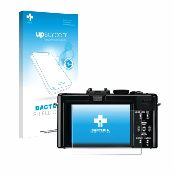 Face avant d’un emballage produit avec le logo de la marque upscreen. À côté, l’appareil Leica D-Lux 5 est représenté avec la 