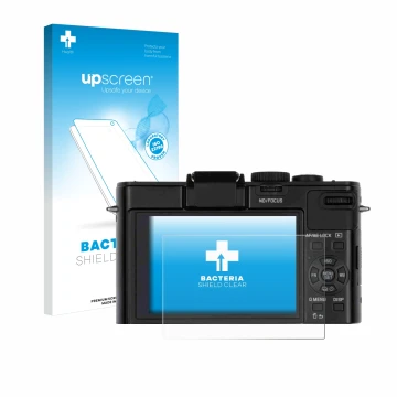 Face avant d’un emballage produit avec le logo de la marque upscreen. À côté, l’appareil Leica D-Lux 6 est représenté avec la 