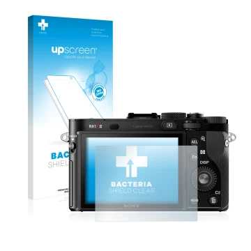 Face avant d’un emballage produit avec le logo de la marque upscreen. À côté, l’appareil Sony Cyber-Shot DSC-RX1R II est repré