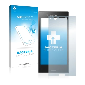 Face avant d’un emballage produit avec le logo de la marque upscreen. À côté, l’appareil Sony Xperia XZ1 Compact est représent