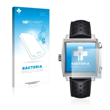 Face avant d’un emballage produit avec le logo de la marque upscreen. À côté, l’appareil TAG Heuer Monaco (39 mm) est représen