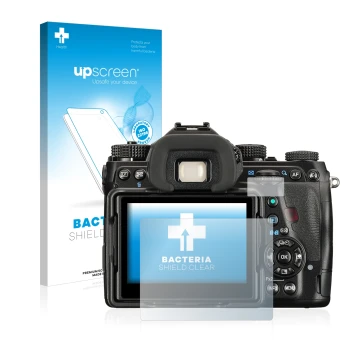 Face avant d’un emballage produit avec le logo de la marque upscreen. À côté, l’appareil Pentax K-1 Mark II est représenté ave