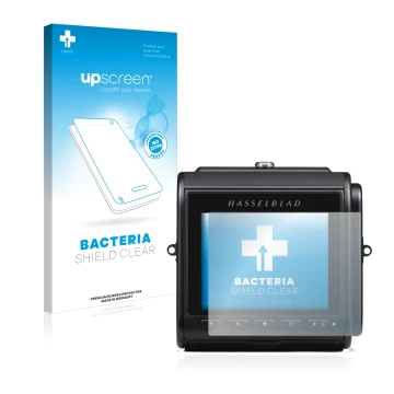 Face avant d’un emballage produit avec le logo de la marque upscreen. À côté, l’appareil Hasselblad 907X 50C est représenté av