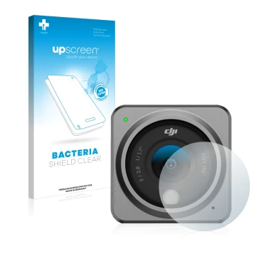 Face avant d’un emballage produit avec le logo de la marque upscreen. À côté, l’appareil DJI Action 2 Lentille (Caisse) est re