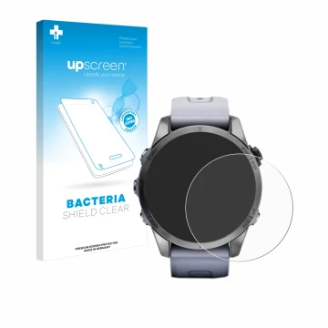 Face avant d’un emballage produit avec le logo de la marque upscreen. À côté, l’appareil Garmin Fenix 7S (42 mm) est représent