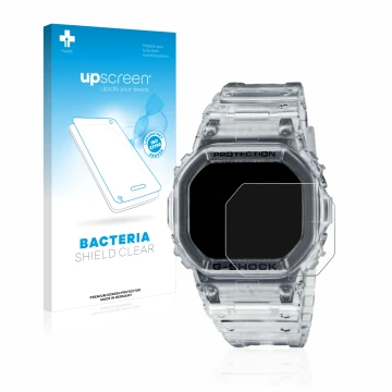 Face avant d’un emballage produit avec le logo de la marque upscreen. À côté, l’appareil Casio G-Shock DW-5600SKE-7 est représ