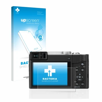 Face avant d’un emballage produit avec le logo de la marque upscreen. À côté, l’appareil Panasonic Lumix DC-TZ95D Super Zoom e