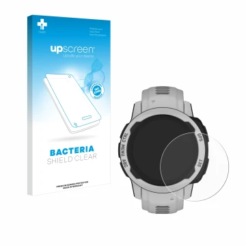 Face avant d’un emballage produit avec le logo de la marque upscreen. À côté, l’appareil Garmin Instinct 2S Solar (40 mm) est 