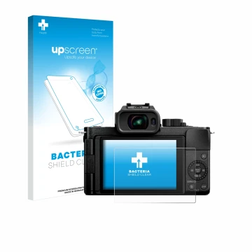 Face avant d’un emballage produit avec le logo de la marque upscreen. À côté, l’appareil Panasonic Lumix DC-G100D est représen