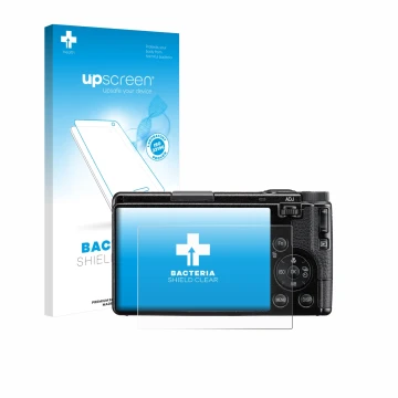 Face avant d’un emballage produit avec le logo de la marque upscreen. À côté, l’appareil Ricoh GR IV HDF 2025 est représenté a
