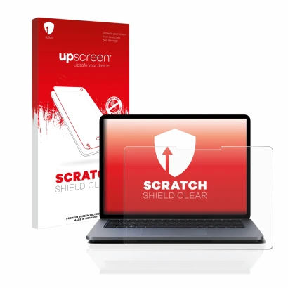 Face avant d’un emballage produit avec le logo de la marque upscreen. À côté, l’appareil Microsoft Surface Laptop Studio est r