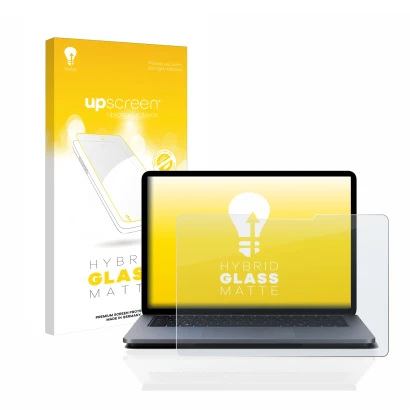 Face avant d’un emballage produit avec le logo de la marque upscreen. À côté, l’appareil Microsoft Surface Laptop Studio est r